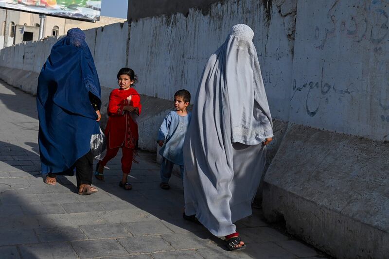 Afghan burka-clad women walk down a road in Kandahar on August 28th. Photograph: Wakil Koshar/AFP via Getty