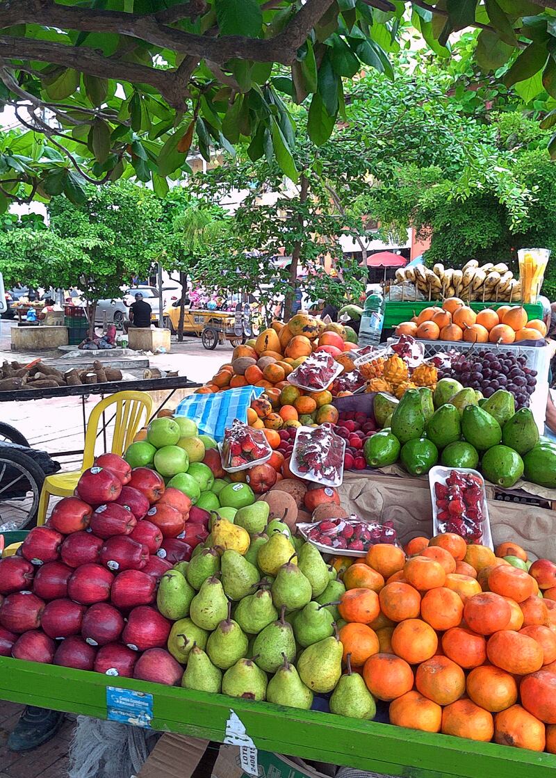 Plazas are festooned with stalls of tropical fruits in a rainbow palette