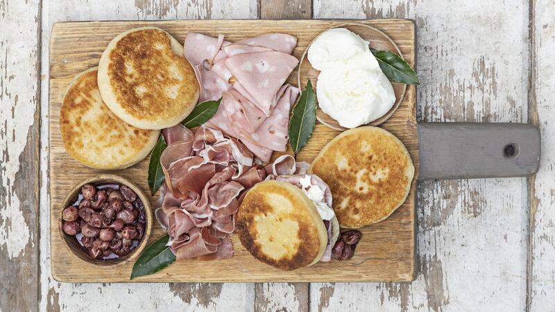Tigelle, mostarda grapes, burrata and salumi. Photographs: Harry Weir