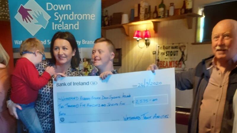 Club chairman Willie Hanrahan (right) presenting a cheque to Down Syndrome Waterford Branch for €2,575, proceeds from a Waterford Trout Anglers’ competition