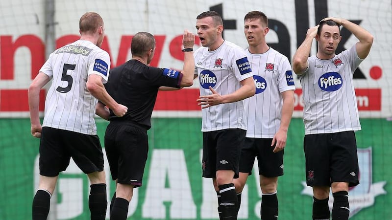 Dundalk’s Chris Shields protests with referee Anthony Buttimer after he was shown a red card for a professional foul  in the FAI Cup semi-final at United park. Photograph: Ryan Byrne/Inpho