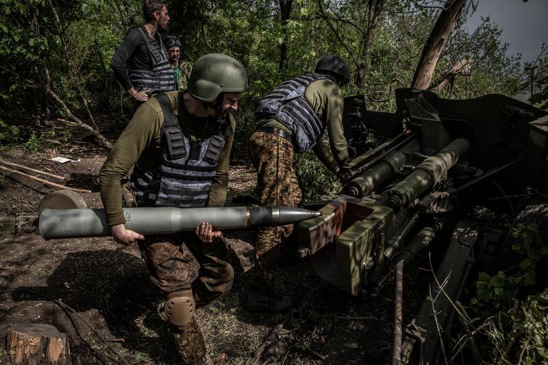 Ukrainian soldiers reload artillery while engaged in battle with Russian forces near Vuhledar, Ukraine on May 31st. 