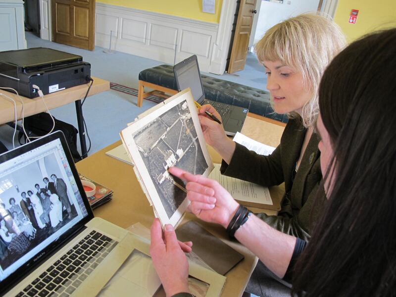Shirley Clerkin scanning images for Photo Album of the Irish