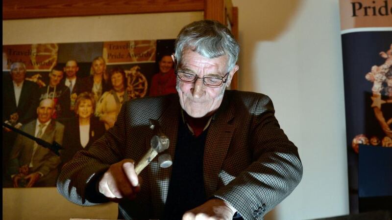 Tinsmith Tom McDonnell displays the art of tinsmithing during the Traveller Pride Awards.  Photograph: Brenda Fitzsimons