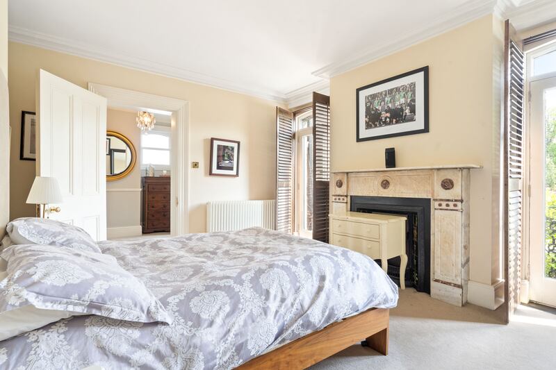 Bedroom on first return with twin Juliet balconies overlooking garden