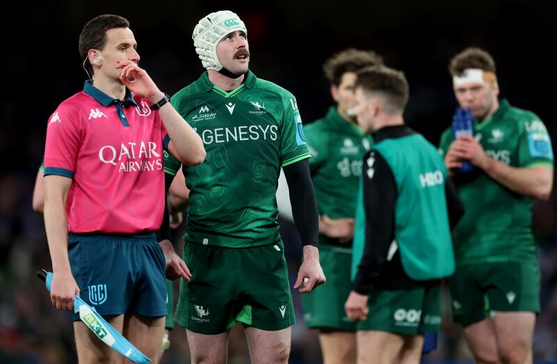 Assistant referee Peter Martin and Connacht's Mack Hansen watch a TMO review during Saturday's Leinster vs Connacht match at the Aviva Stadium. Photograph: James Crombie/Inpho