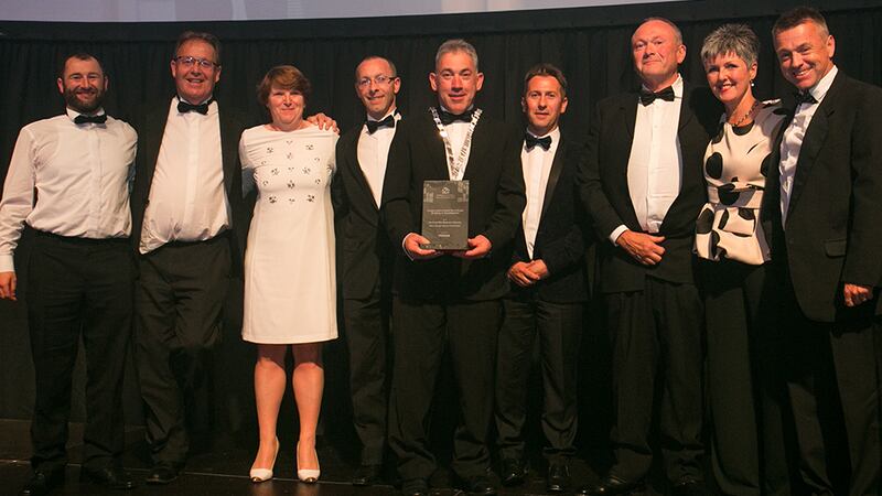 Stephen Pierce, Senior Area Manager Vescom Wallcoverings & Fabrics presents the Conservation Award for a Single Building or Development Award to McCullough Mulvin Architects and the Kilkenny County Council team.