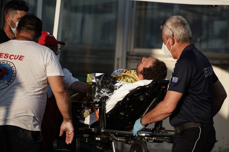 A survivor is transferred by rescuers after a boat carrying hundreds of people sank in the Ionian Sea. Photograph: Menelaos Myrillas /AFP via Getty Images
