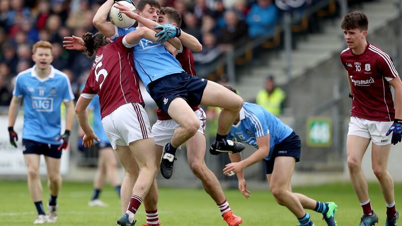Galway’s Kieran Molloy and Michael Daly tangle with Brian Howard of Dublin under a high ball. Photograph: Inpho