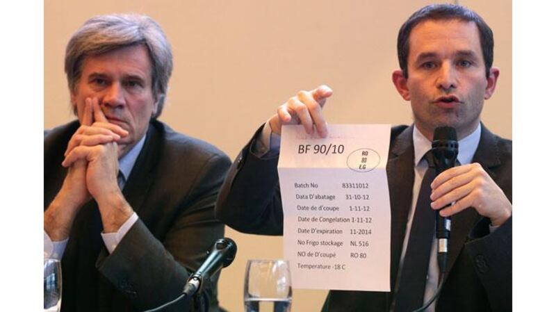 France's erstwhile minister of consumer affairs Benoît Hamon holds a meat packing information sheet after announcing that the supplier Spanghero had sold horsemeat labelled as beef. Photograph: Jacky Naegelen/Reuters