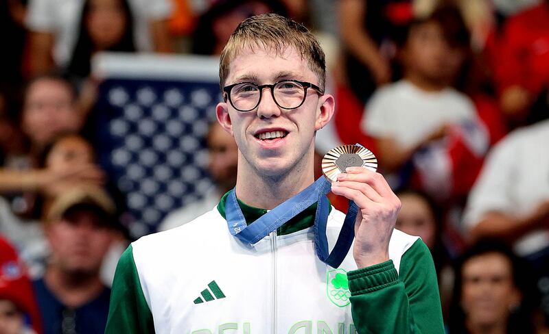 Daniel Wiffen celebrates after receiving his bronze medal in the men's 1,500m freestyle final. Photograph: Ryan Byrne/Inpho