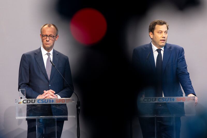 Friedrich Merz, (left), leader of the Christian Democratic Union, and Lars Klingbeil of the German Social Democrats (SPD) speak to the media during the presentation of the coalition contract earlier this month. Photograph: Maja Hitij/Getty Images