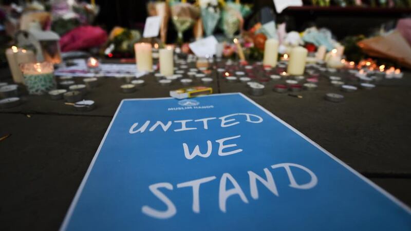 Tributes at a vigil for the people who lost their lives during the Manchester terror attack in central Manchester. Photograph: Andy Rain /EPA