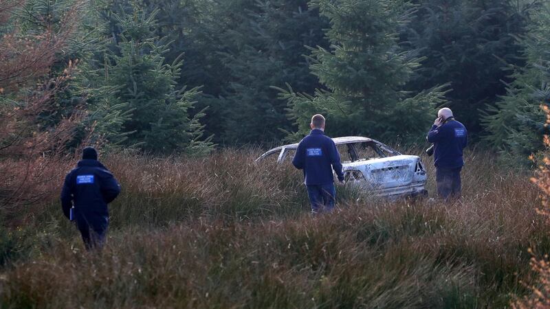 One of the suspected getaway vehicles used by the gunmen who killed  Clive Staunton in Co Kildare last night is seen at Ballyfolan in the Wicklow Mountains. Photograph: Collins
