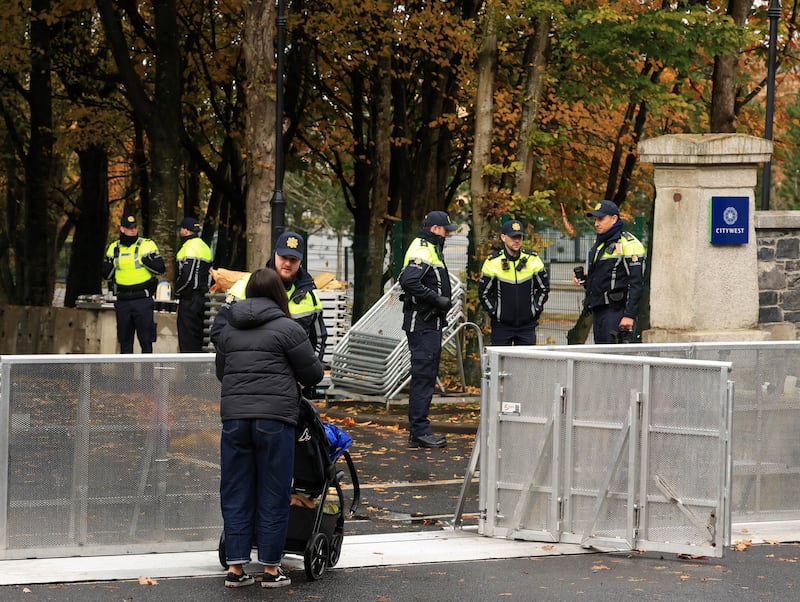 Gardaí check identification of residents before letting them through barriers outside the Citywest Hotel and IPAS Centre on Thursday. Photograph: Colin Keegan/Collins Dublin