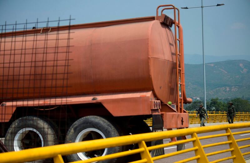 Venezuelan military forces stand guard near the blockade on the bridge Photograph: Raul Arboleda/AFP/Getty