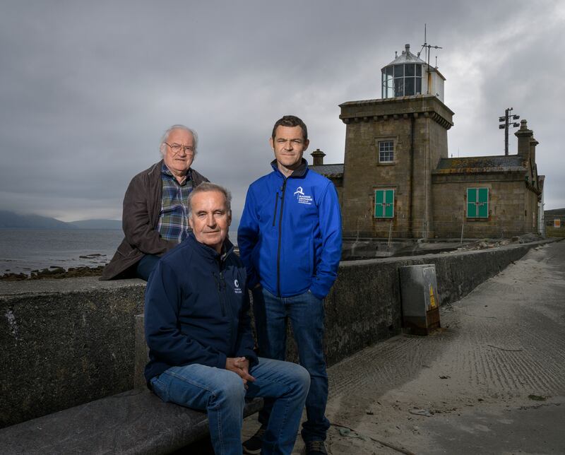 Vincent Sweeney, attendant lighthouse keeper (front) with his brother Gerry, assistant attendant lighthouse keeper (left) and nephew Fergus Sweeney, Blacksod lighthouse tour guide. Photograph: Michael McLaughlin