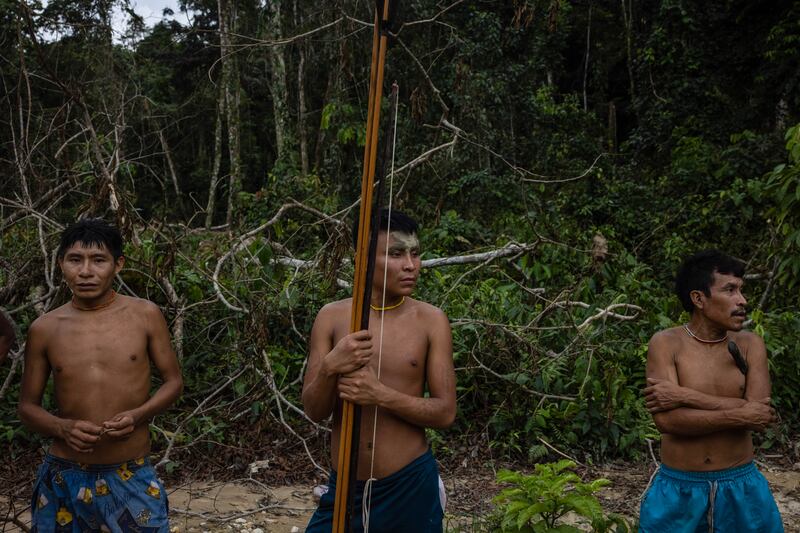 The Yanomami people, who emerged from the rainforest when members of Brazil’s environmental special forces team arrived to destroy illegal mining equipment in the Yanomami Indigenous territory of Brazil. Photograph: Victor Moriyama/The New York Times
                      