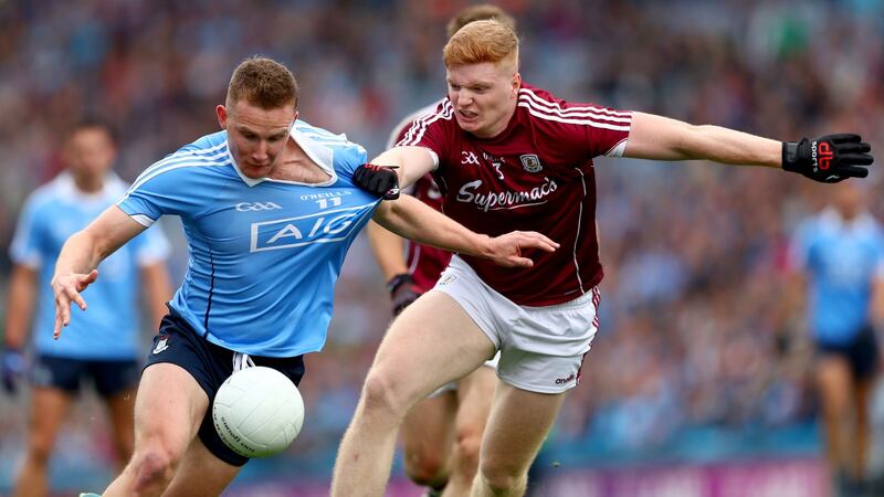 Dublin’s Ciarán Kilkenny is held by Galway’s  Seán Andy Ó Ceallaigh during the All-Ireland SFC semi-final at Croke Park. Photograph: James Crombie/Inpho