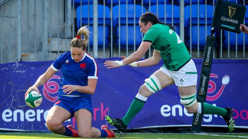 Romane Menager scores a try despite Hannah O’Connor. Photo: Ryan Byrne/Inpho