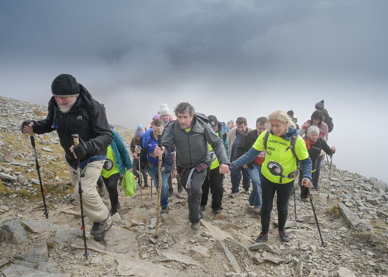 Charlie Bird climbs Croagh Patrick to raise funds for two charities that were very close to his heart – the Irish Motor Neurone Disease Association and Pieta, Ireland’s national suicide prevention charity – in April 2022. Photograph: Michael Mc Laughlin/RollingNews.ie