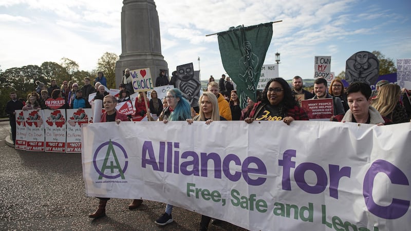 Members of Alliance for Choice make their way past anti-abortion supporters at Stormont. Photograph: Charles McQuillan/Getty