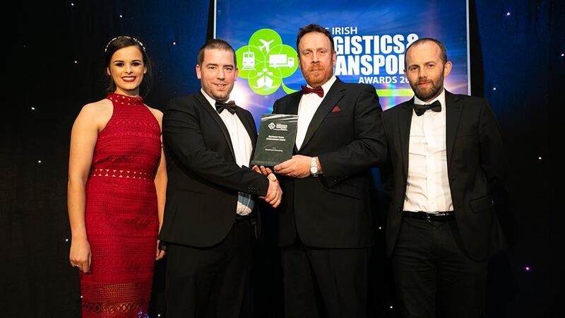 Declan Allen, Judging Co-ordinator presents the Customer Focus Achievement Award to the Greyhound Recycling team.
