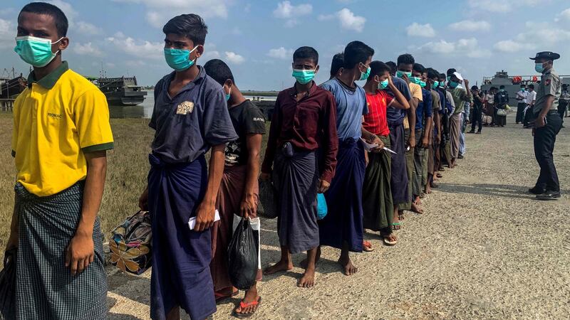 Released Rohingya prisoners arrive in Sittwe jetty in Rakhine State after being transported by military boat. Photograph:   STR/AFP via Getty Images