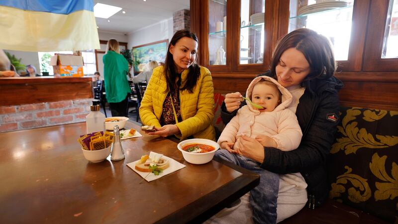 Anna Makkeo with  Marta Bitar and her daughter Aisha. Photograph: Alan Betson