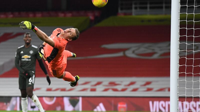 Bernd Leno dives as a shot from Bruno Fernandes goes wide. Photo: Andy Rain/AFP via Getty Images