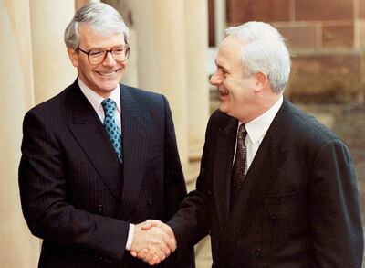 British prime minister John Major shakes hands with John Bruton as they leave Hillsborough Castle before the publication of the joint framework document. Photograph: Crispin Rodwell/Reuters
