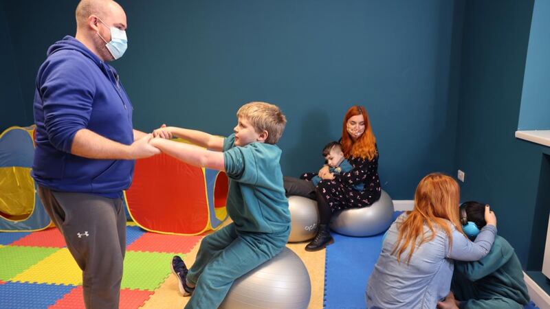 Teacher Jason Kelly, with SNAs Chantelle Davis and Sandra Keogh, in the special class for children with autism in Cnoc Mhuire Senior School, Killinarden, Dublin. Photograph: Dara Mac Dónaill