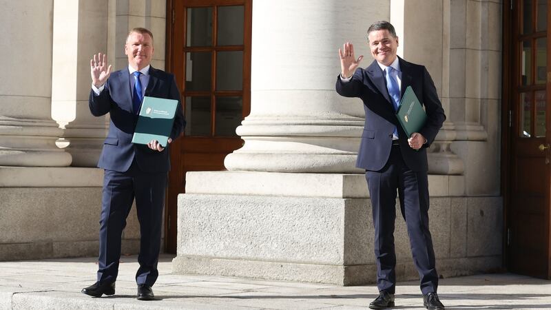 Finance Minister Paschal Donohoe (L) and Public Expenditure Minister Michael McGrath arrive at Government Buildings in Dublin before outlining details of the budget to the Dáil. Photograph: Liam McBurney/PA Wire