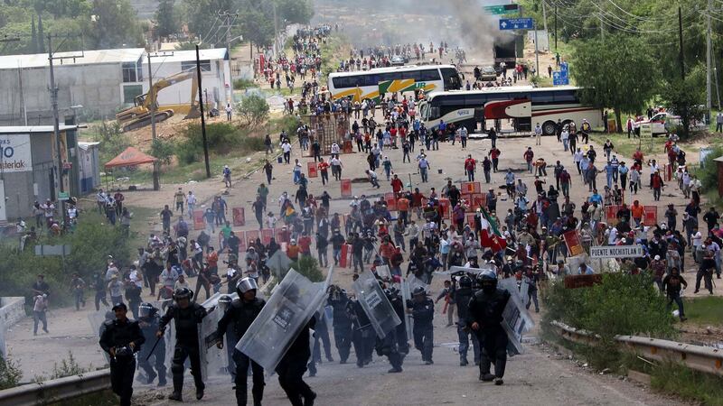 Riot police are forced to fall back as they battle with protesting teachers who were blocking a federal highway in the state of Oaxaca, near the town of Nochixtlan, Mexico, Sunday, June 19th, 2016. Photograph: Luis Alberto Cruz Hernandez/AP