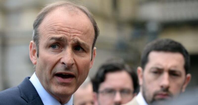 Fianna Fáil leader Micháel Martin has accused the Taoiseach of “hiding” from questions about the Fennelly commission, set up to investigate events leading to the departure of Martin Callinan as Garda commissioner last year.