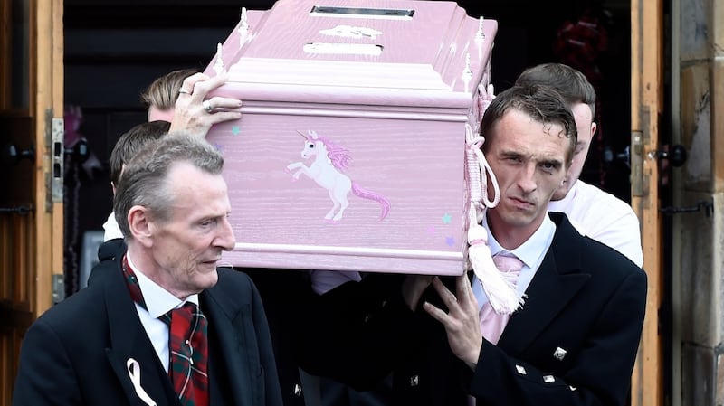The coffin of six-year-old Alesha MacPhail is carried out of the Coats Funeral Home in Coatbridge, Scotland. Photograph: Lesley Martin – WPA Pool/Getty Images