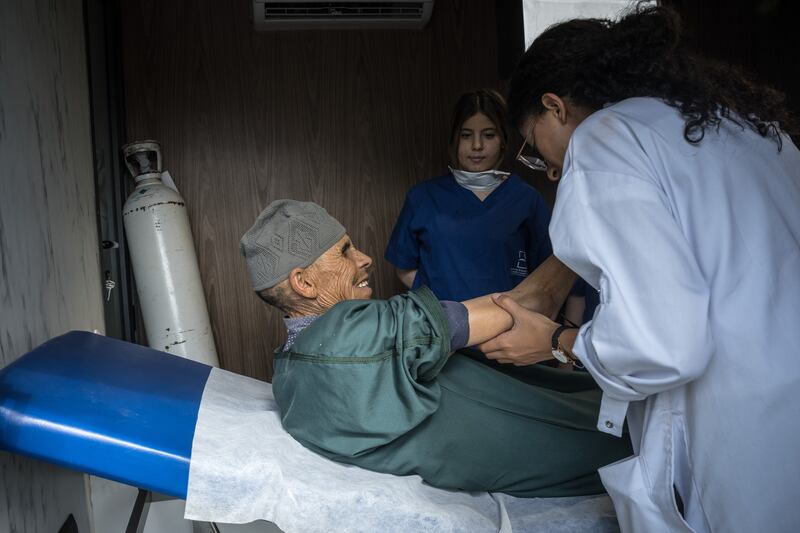 A man is treated for injuries sustained in the earthquake at a temporary medical facility in Ouirgane, Morocco. The crisis is likely to aggravate inequality between urban areas and the rural ones that never received much in the way of support service. Photograph: Sergey Ponomarev/New York Times
                      