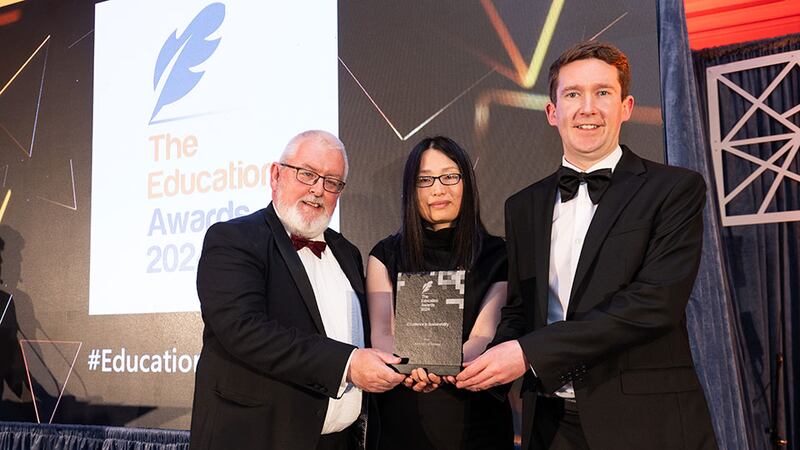 Yuxin Wang, awards judge, presents the excellence in sustainability award to Prof Pól Ó Dochartaigh and Dr Richard Manton, University of Galway