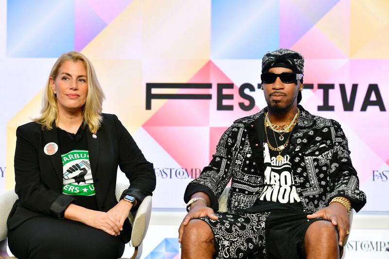 Sara Nelson, president of the Association of Flight Attendants-CWA, and Christian Smalls, president of Amazon Labour Union: Nurses, baristas, graduate students, actors and screenwriters all walked off the job in the US this year. Photograph: Eugene Gologursky/Getty Images 
