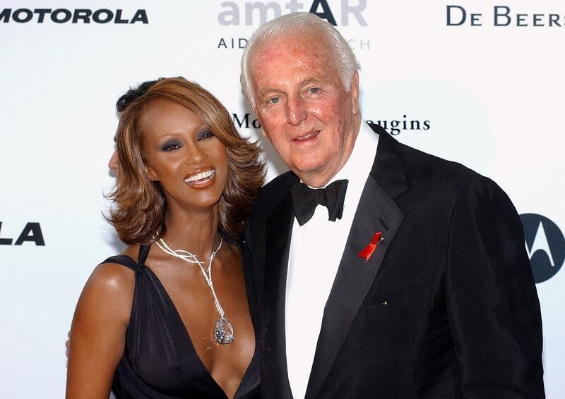 With model Iman at the amFar (American Foundation for Aids Research) benefit party in Mougins, near Cannes., in 2002. Photograph: AFP