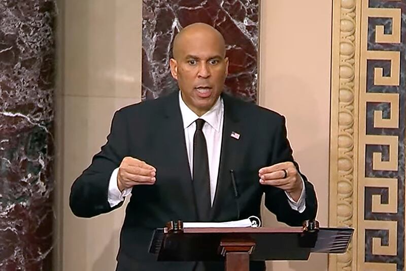 Senator Cory Booker gestures during his 25-hour speech. Photograph: Senate Television via AP