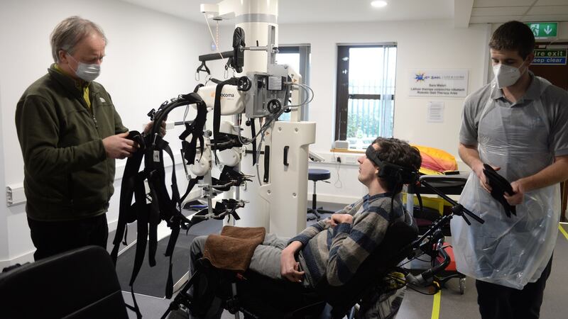 Schaler (left) helping his son Pádraig. Photograph: Dara Mac Dónaill/ The Irish Times