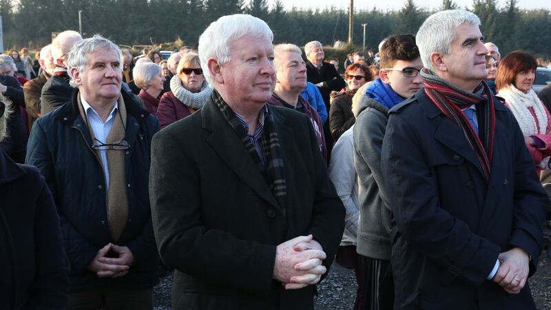 Frank Flannery looks at a big screen outside Killimordaly Community Hall during his brother Tony’s Mass of Celebration on Sunday. Photograph: Joe O’Shaughnessy