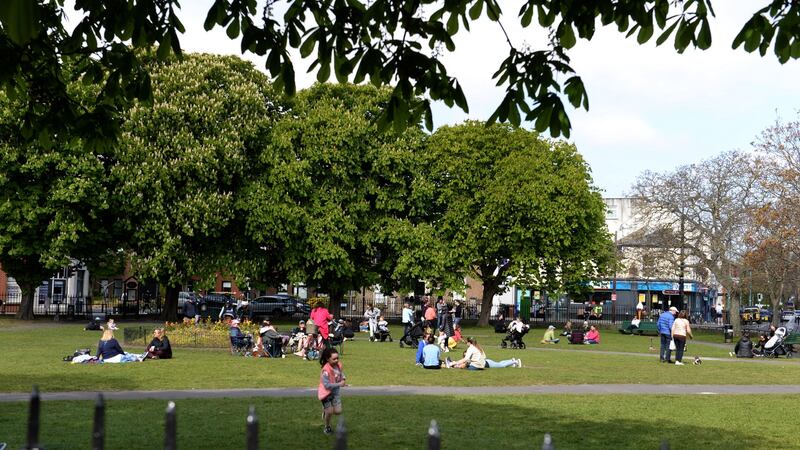People gather on Sandymount Green in Dublin 4.  The Cabinet is on Thursday set to approve a plan to significantly ease Covid-19 restrictions over the coming weeks. Photograph: Dara Mac Dónaill/The Irish Times.