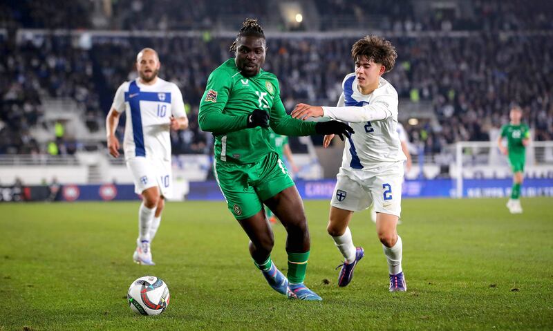 Ireland's Festy Ebosele in action against Finland’s Tomas Galvez. Photograph: Ryan Byrne/Inpho