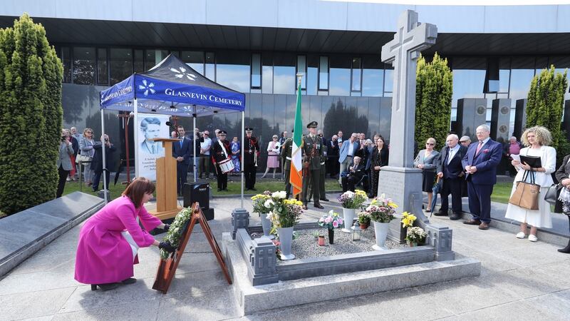 Minister for Culture, Heritage and the Gaeltacht Josepha Madigan lays a  wreath at the grave of Michael Collins during the 97th annual Michael Collins and Arthur Griffith commemoration at Glasnevin Cemetery in Dublin. Photograph: Niall Carson/PA Wire