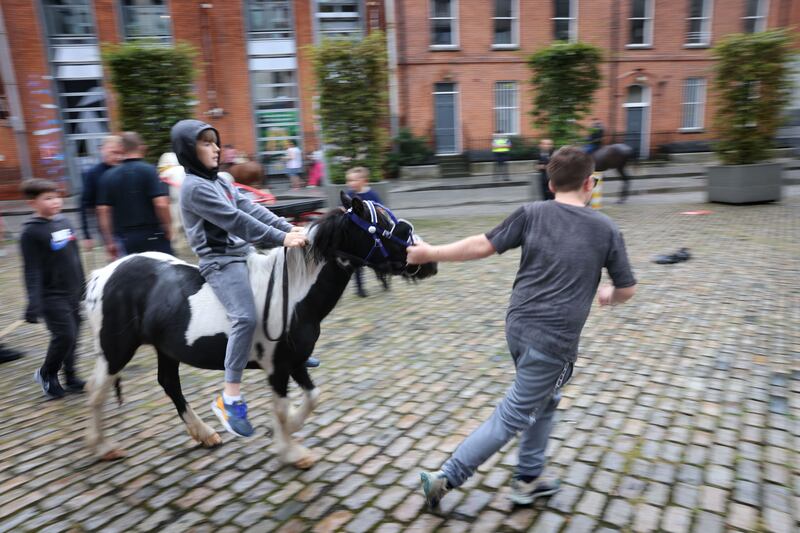 Kids gather at the Horse Fair in Smithfield, Dublin.
Photograph: Dara Mac Dónaill/The Irish Times