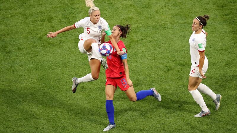 Steph Houghton tackles Alex Morgan. Photo: Lucy Nicholson/Reuters