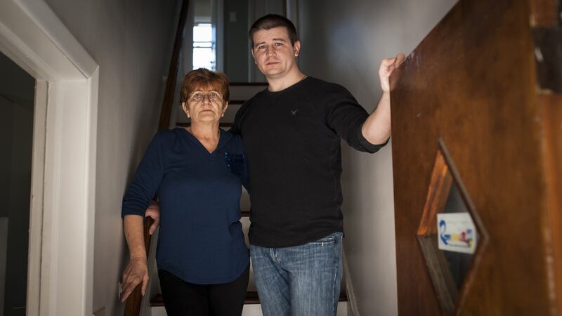 Helen Ochisor with her son, Gabriel Ochisor, at their home in New York. Since Nicanor Oshisor took his own life in March, Helen has taken over driving her husband’s taxi, and Gabriel has been managing the business. Photograph: Kholood Eid/The New York Times