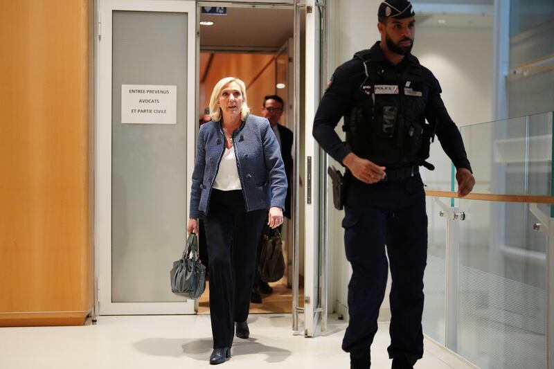Marine Le Pen leaves the courtroom after a French court found her guilty of embezzlement of EU funds. Photograph: Thibault Camus/AP